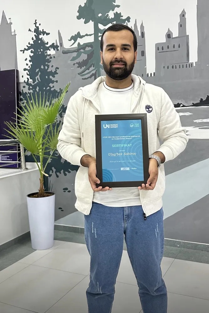 Holding the TOP CEO program certificate